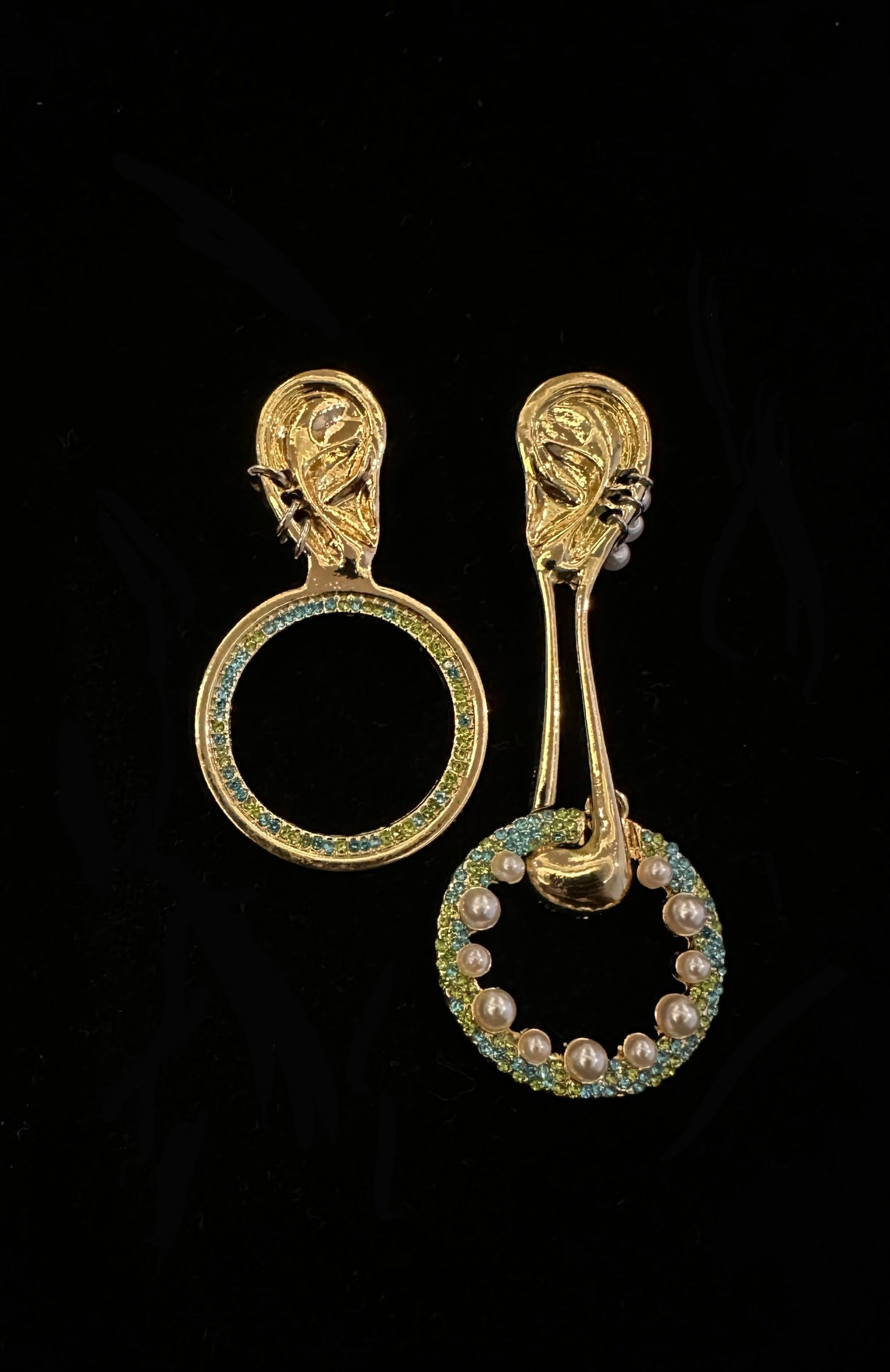 The Ear of the Muse Asymmetric Drops